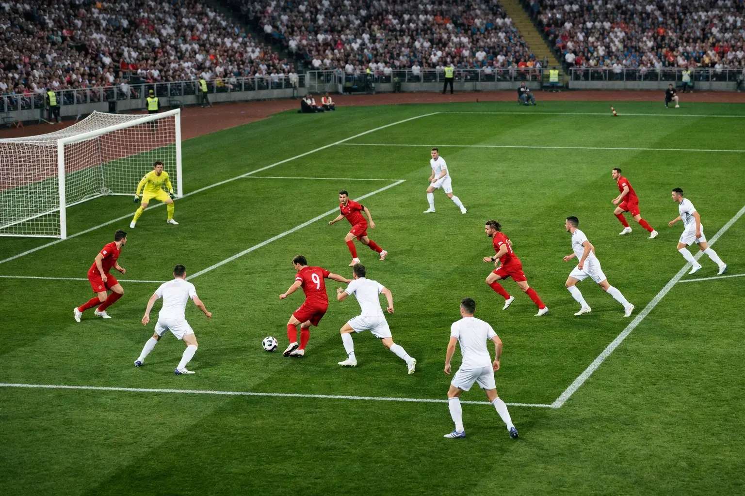 Deux équipes de football s'affrontant dans un match offensif